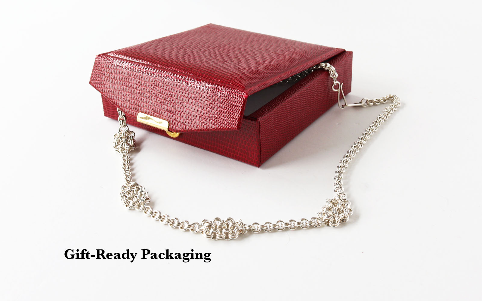 Gift-Ready Packaging shown with Argentium double cable chain draped alongside the red faux leather gift box with gold accents.