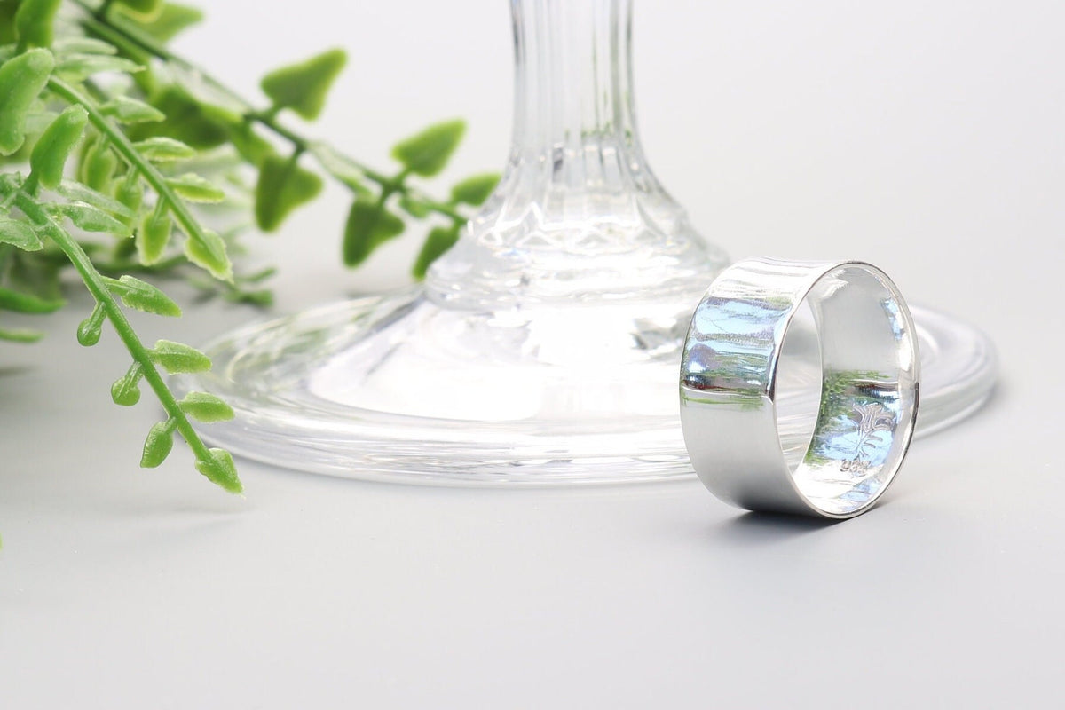 Solid Argentium 935 silver wide band ring with polished anticlastic contour and Elkhorn Silver maker's mark