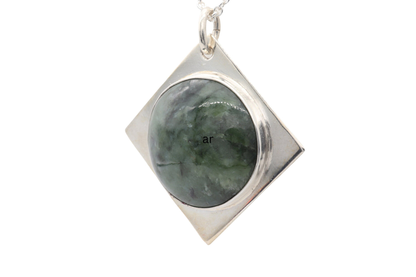 A handcrafted design from Elkhorn Silver™ that showcases a polished Wyoming Jade cabochon stone. This exceptional stone has been thoughtfully selected for its distinct coloring and composition, and it's encased in the finest Argentium® 935 Silver.