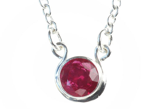 Handcrafted in our studio, a dainty and colorful lab-created 6mm Ruby. Set in solid sterling Argentium® 935 Silver, this elegant piece showcases the perfect combination of beauty and durability.