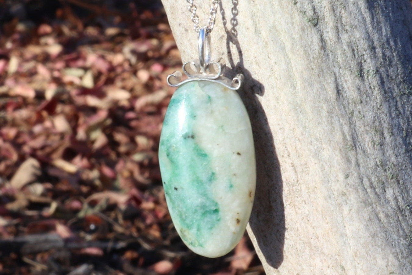 Lovingly handcrafted in our Missouri, USA studio is this natural 1.81 inch African Turquoise Jasper reversible pendant. Handcut and freeform polished to reveal the unique shades of green and cream hues crafted with a premium bow-shaped wire bail in sterling 935 Argentium silver plus a complementary sterling 935 Argentium chain ensuring both style and longevity.