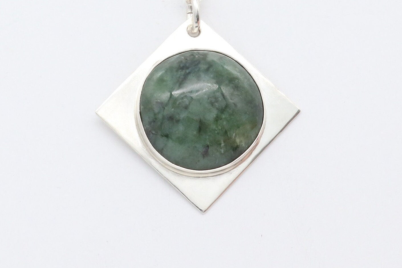 A handcrafted design from Elkhorn Silver™ that showcases a polished Wyoming Jade cabochon stone. This exceptional stone has been thoughtfully selected for its distinct coloring and composition, and it's encased in the finest Argentium® 935 Silver.