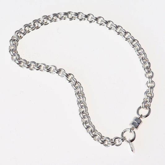 A handcrafted double cable chain bracelet in solid sterling 935 Argentium solid silver. This eye-catching double cable weave bracelet features a magnetic clasp that holds securely, yet opens and closes easily. sterling Argentium 935 is known for its tarnish resistant hypoallergenic qualities and contains more pure silver than the typical .925 Sterling silver.