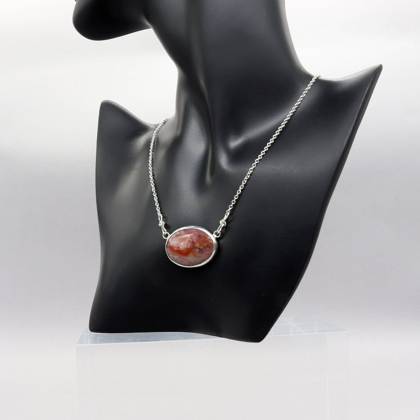 This unique Jasper gemstone was found in the Yellowstone River during a hike in Montana. It has been hand-cut and polished in our Missouri USA studio and set in a handcrafted solid sterling Argentium® 935 Silver bezel paired with an attached crafted custom chain with custom shepherd's hook clasp, resulting in a one-of-a-kind statement Necklace.