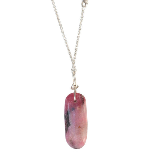 Handcrafted in our Missouri studio is this natural pink Rhodonite crystal pendant with black inclusions, handcut and polished to showcase its natural beauty on either side. The pendant is crafted with a custom infinity bow shaped bail, in sterling Argentium 935 silver and to complete the look a complementary 935 Argentium silver chain is included.