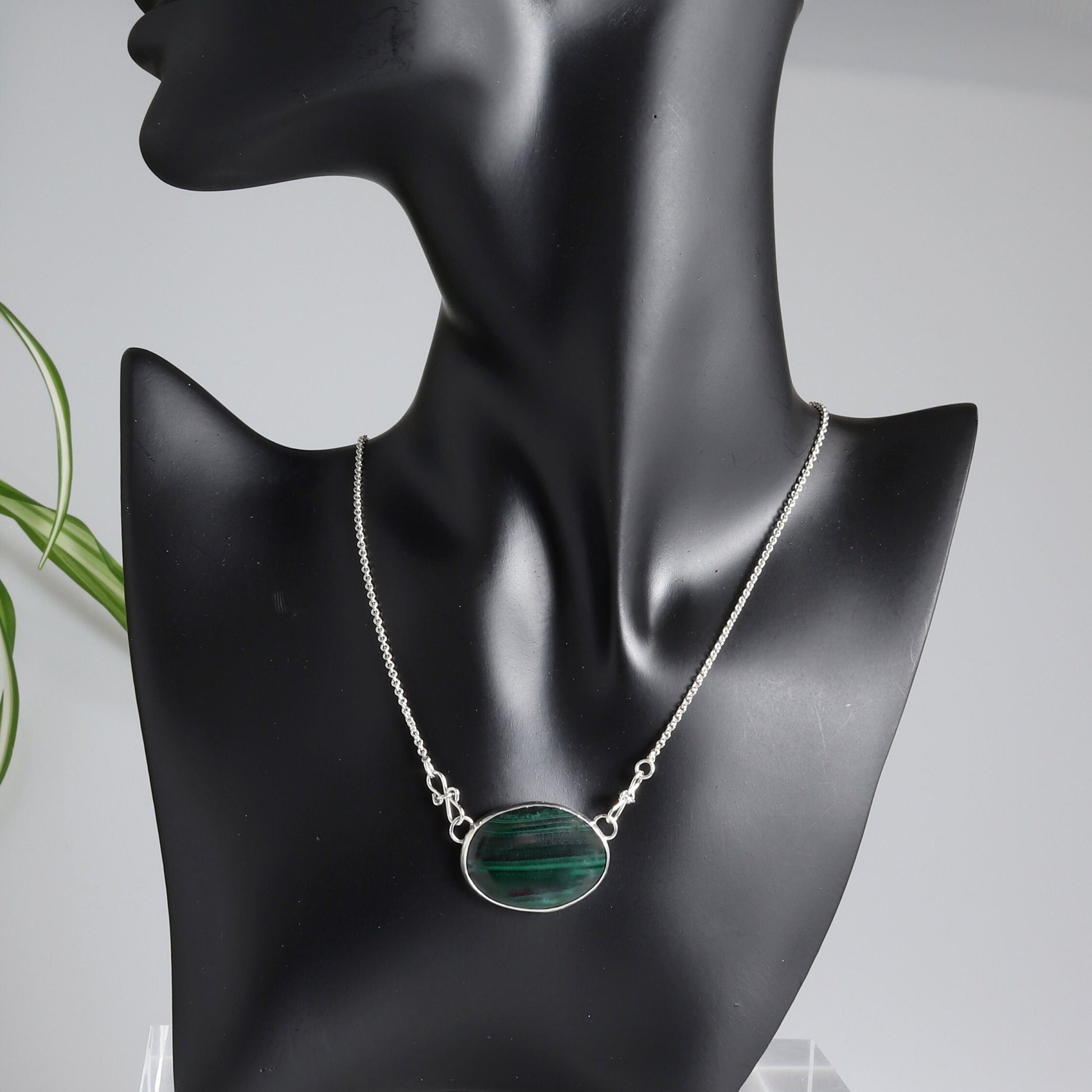 A unique Malachite gemstone pendant hand-cut and polished stone and set in solid sterling 935 Argentium® Silver. Designed with a custom chain and S hook for easy wearability.