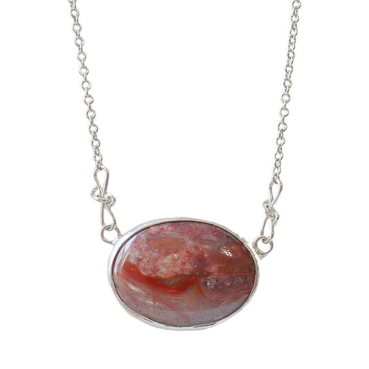 This unique Jasper gemstone was found in the Yellowstone River during a hike in Montana. It has been hand-cut and polished in our Missouri USA studio and set in a handcrafted solid sterling Argentium® 935 Silver bezel paired with an attached crafted custom chain with custom shepherd's hook clasp, resulting in a one-of-a-kind statement Necklace.