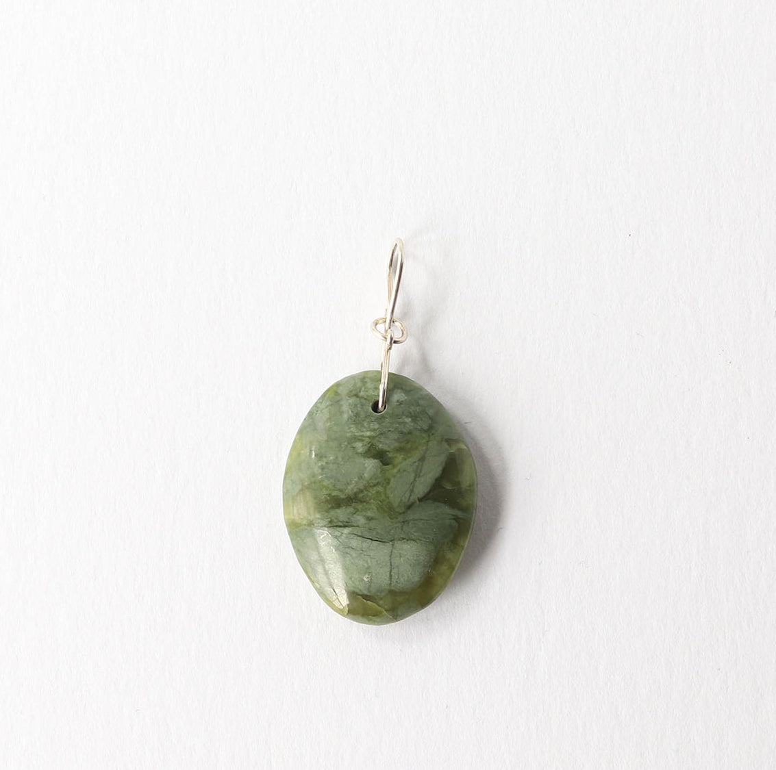 A single California green jade polished stone pendant with a silver wire loop at the top, shown against a plain white background.