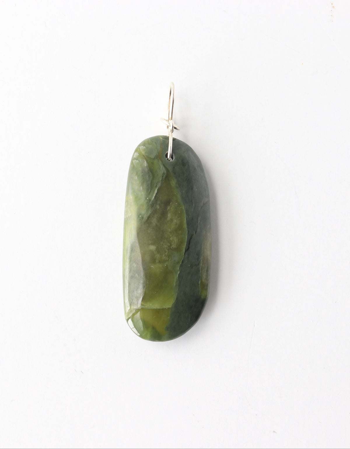A one-of-a-kind California Nephrite jade pendant, hand-shaped and polished to highlight rich green tones, natural variation, and soft translucency. Finished with a handcrafted 935 Argentium® Silver bow-style bail. With Optional 18" handcrafted Argentium® chain (S-hook clasp)
