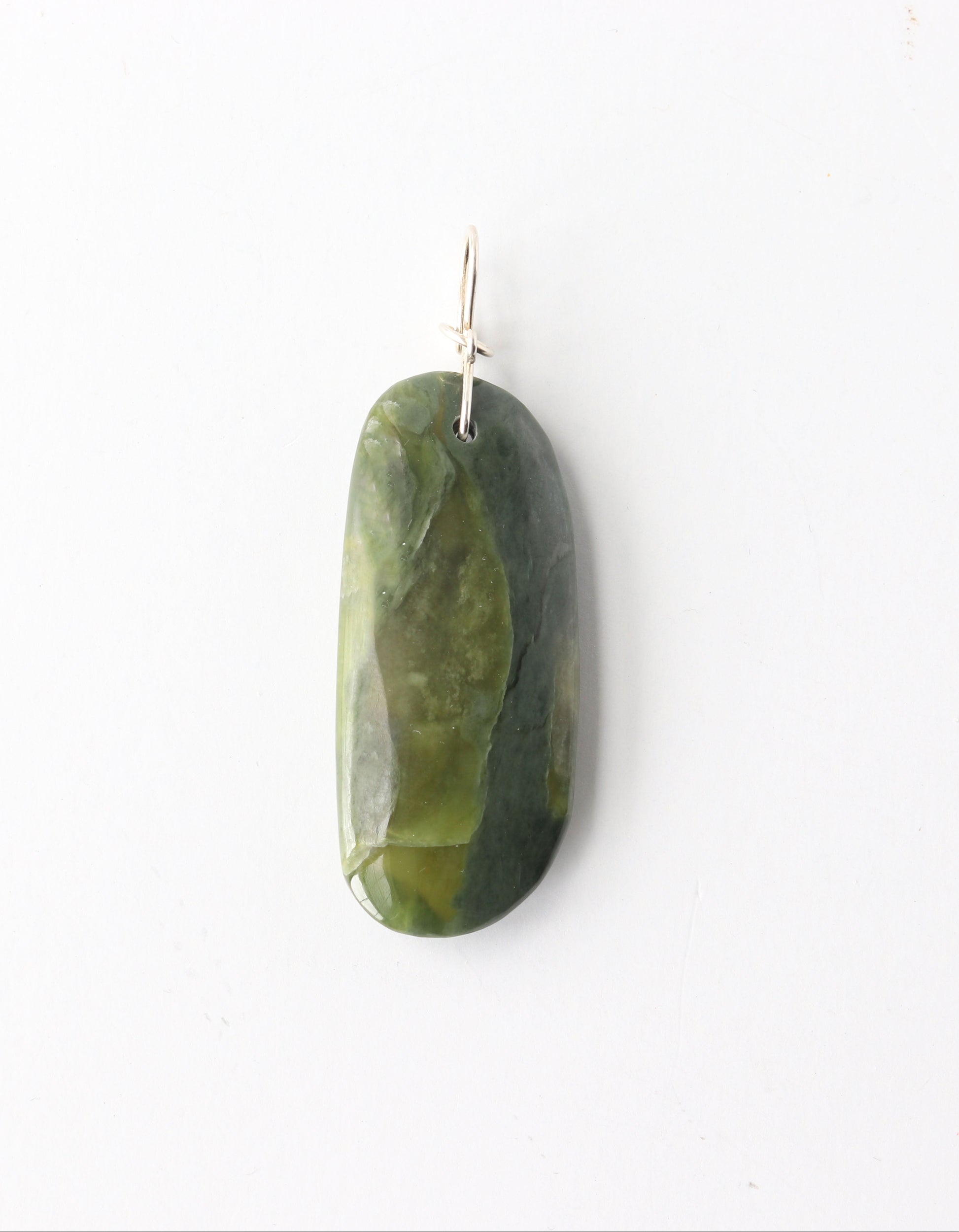 A one-of-a-kind California Nephrite jade pendant, hand-shaped and polished to highlight rich green tones, natural variation, and soft translucency. Finished with a handcrafted 935 Argentium® Silver bow-style bail. With Optional 18" handcrafted Argentium® chain (S-hook clasp)