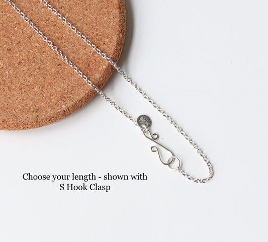 Argentium® 935 Silver oval chain necklace with s-hook clasp shown on cork with white background.