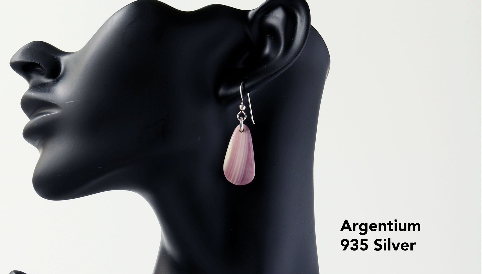 Introducing this exquisite pair of Lavender and Cream earrings in sterling Argentium 935 silver.  Shown on a black resin boutique jewelry manniquin against a light gray background.