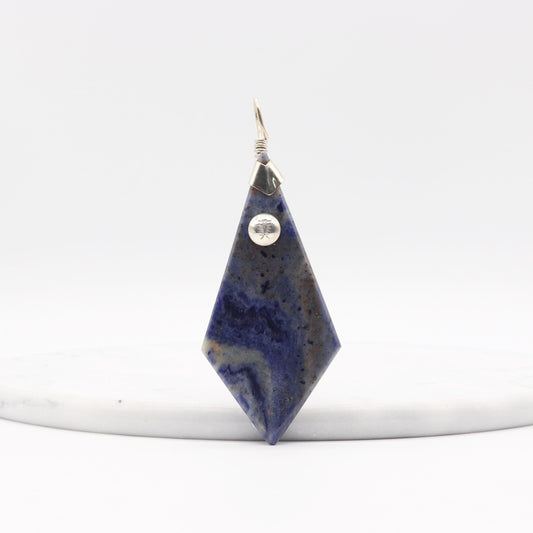 Blue Sodalite Pendant – Argentium® Silver Handmade on a white marble with a white background