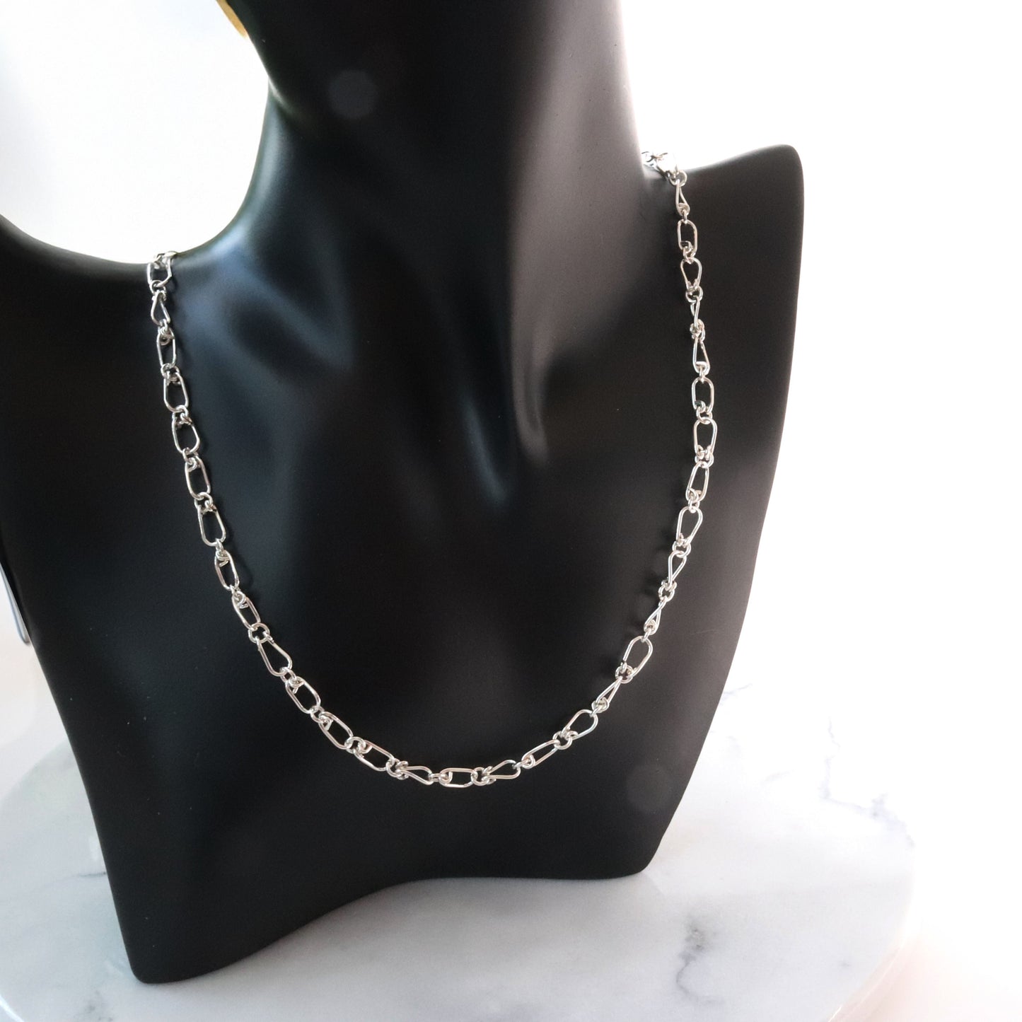 Discover the timeless beauty of our Silver Teardrop Chain Necklace, meticulously handcrafted in our Missouri studio using premium .940 Argentium sterling silver. This delicate yet durable chain features uniquely designed teardrop-shaped links, each crafted from 20-gauge wire for a refined and sophisticated look.