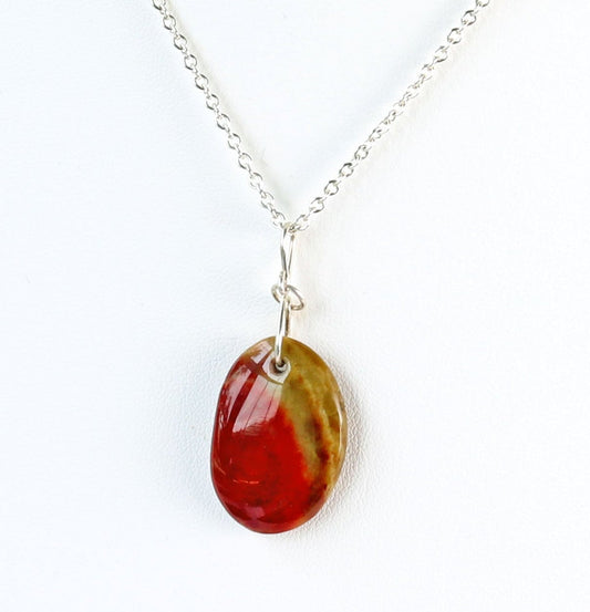 Argentium Necklace with a oval-shaped sonoran sunrise green and red pendant on a white background