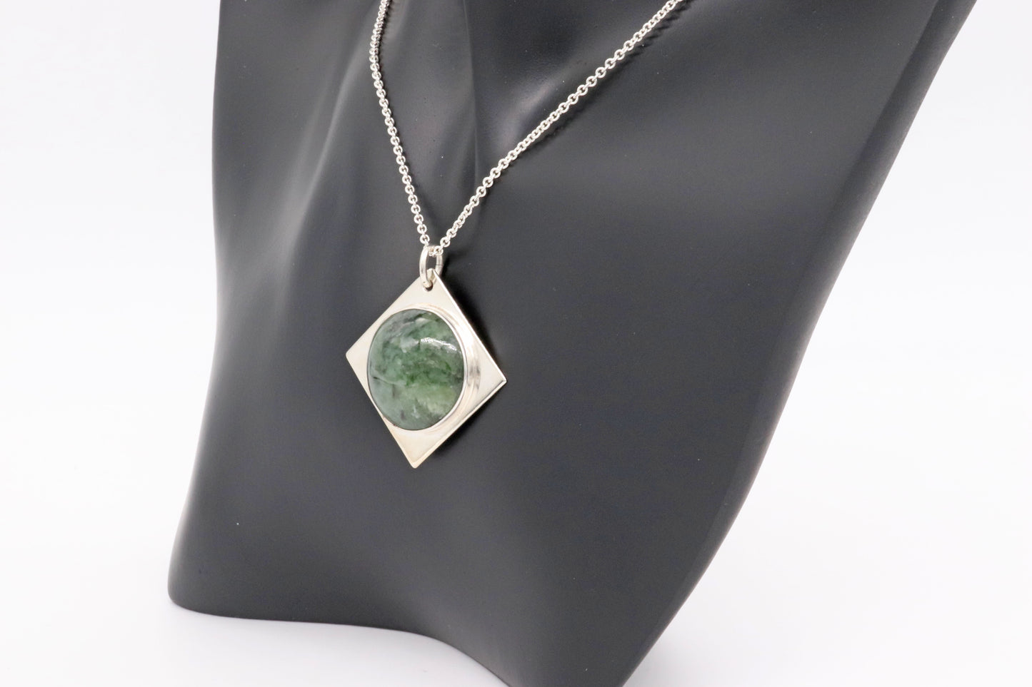 A handcrafted design from Elkhorn Silver™ that showcases a polished Wyoming Jade cabochon stone. This exceptional stone has been thoughtfully selected for its distinct coloring and composition, and it's encased in the finest Argentium® 935 Silver.&nbsp;