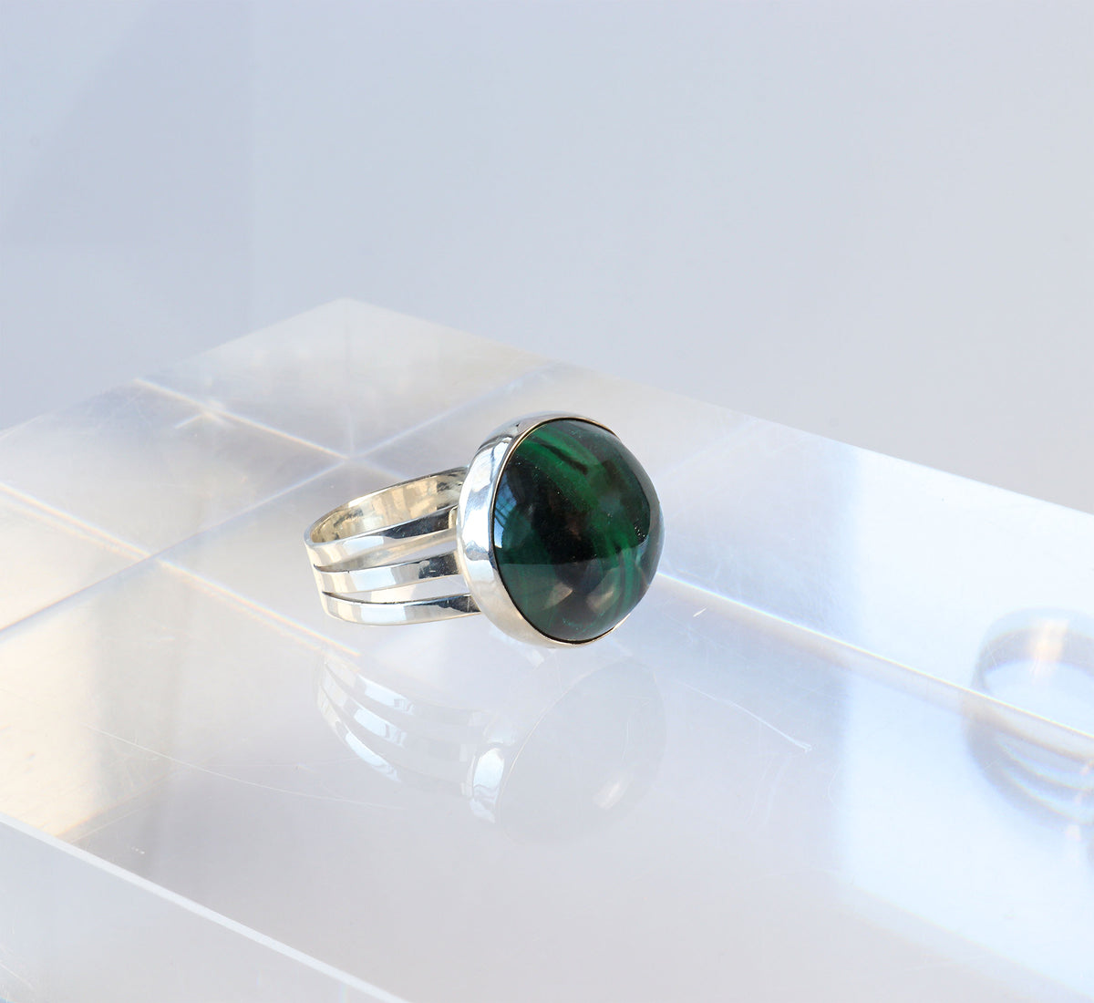 Handcrafted natural green Malachite ring with oval cabochon, polished fine silver bezel and solid Argentium 935 silver split-shank band.