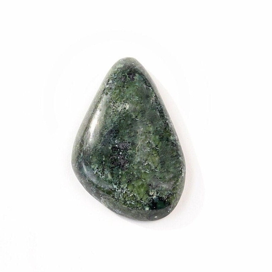 Hand-cut natural Moss Agate freeform cabochon with mottled green pattern shown against white background.