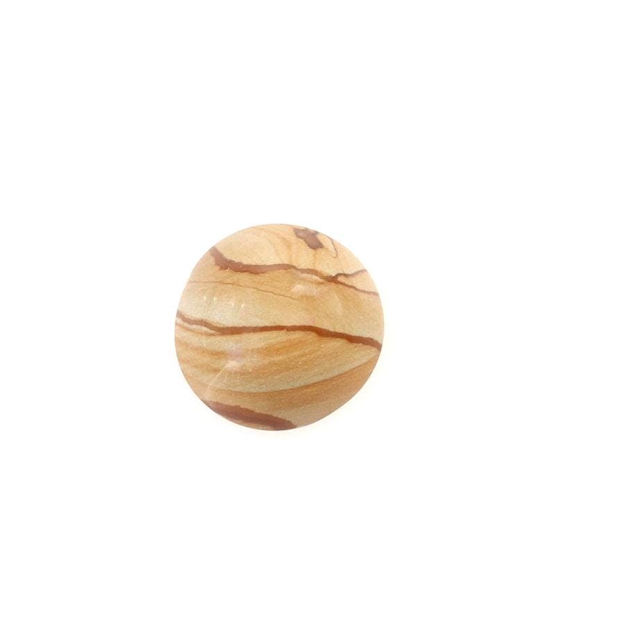 Round Picture Jasper cabochon with natural tan and brown landscape-like banding shown on white background.