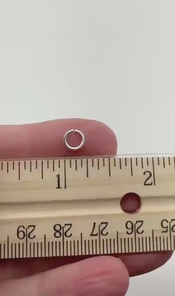 Video clip showing a 4mm jump ring next to a ruler for scale.