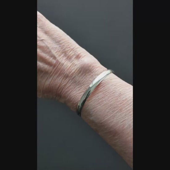 Demo clip shows the Argentium silver low dome cuff bracelet in Small, Medium, and Large on the same 6.25" wrist for comparison. Fit will vary with wrist shape and preferred snugness.