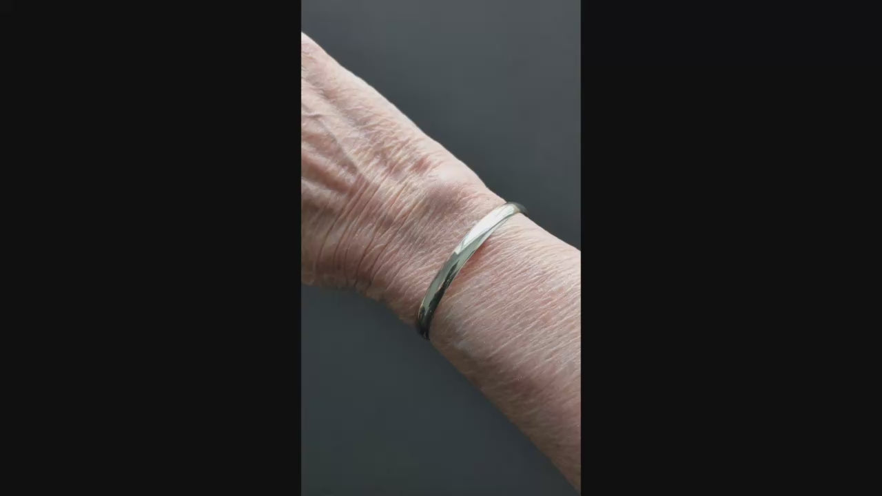 Demo clip shows the Argentium silver low dome cuff bracelet in Small, Medium, and Large on the same 6.25" wrist for comparison. Fit will vary with wrist shape and preferred snugness.