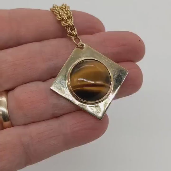 Golden Tiger’s Eye Pendant – Handcrafted in NuGold Brass shown in video clip with hand demonstrating features of pendant.