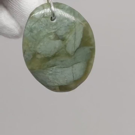 Demo clip of California Jade Pendant handcut and polished with Argentium silver bail shown with white background.