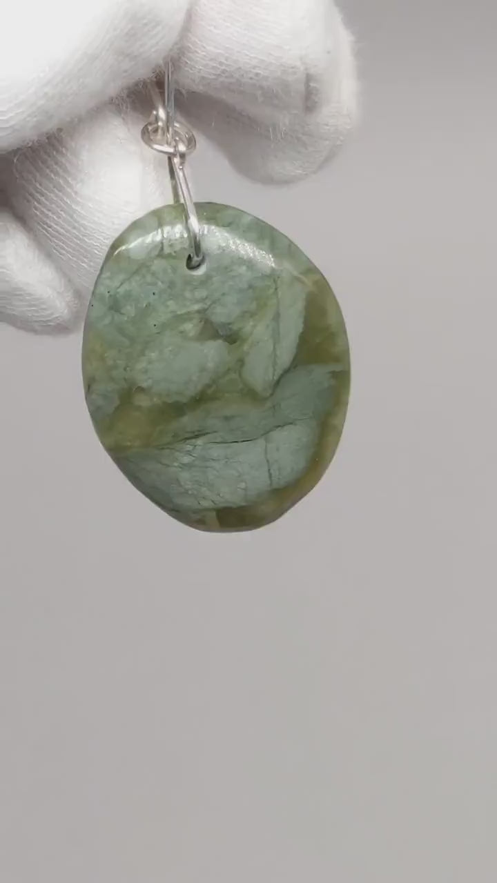 Demo clip of California Jade Pendant handcut and polished with Argentium silver bail shown with white background.