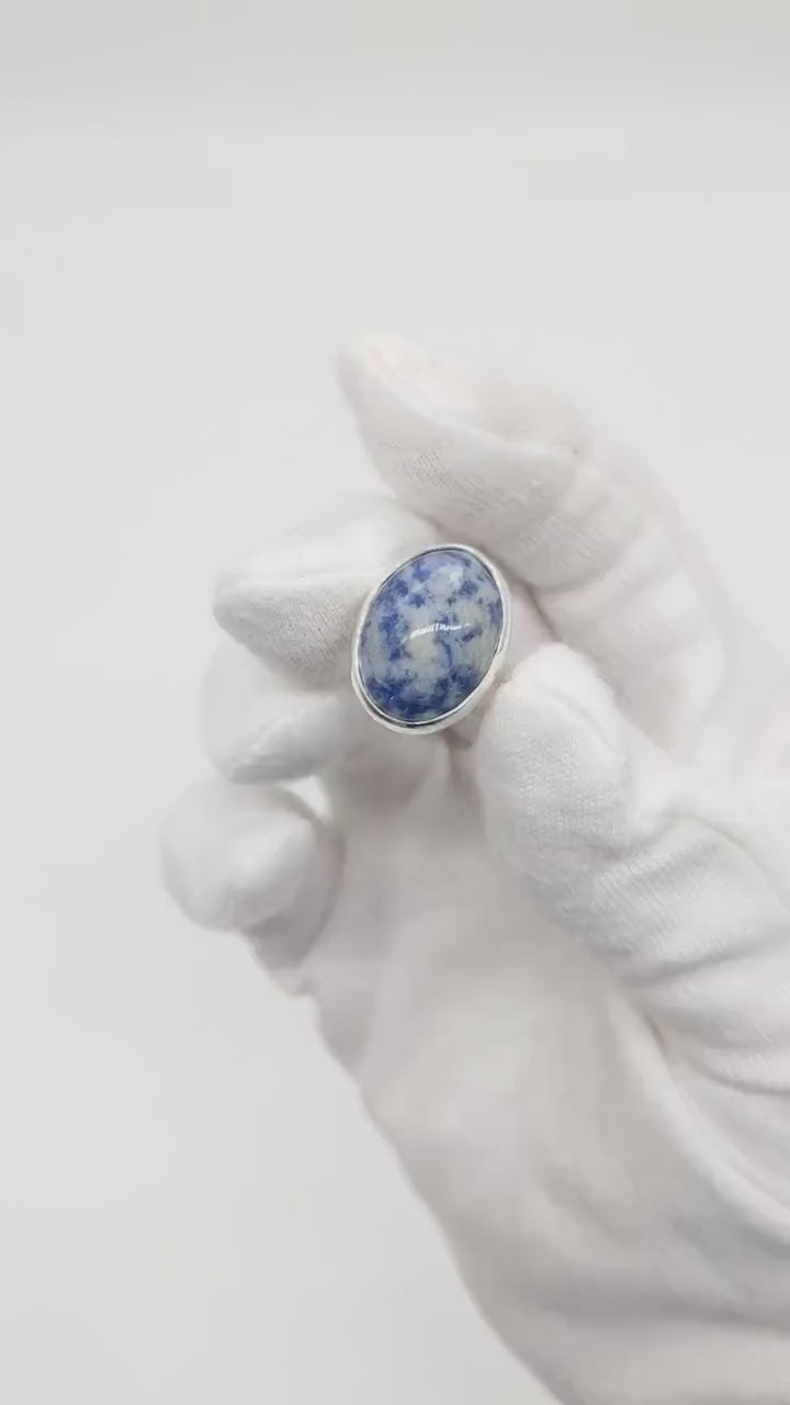 Demo Clip of Blue Sodalite Ring on human hand against white glove background