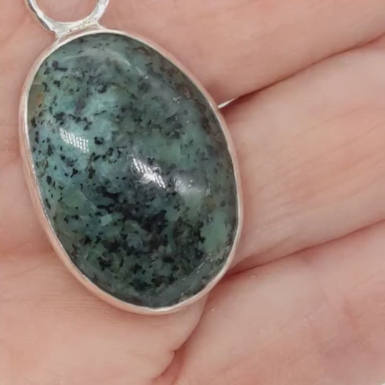 Demo clip of the Fraser River Turquoise Pendant showcasing the bezel features and blue-green and black matrix patterns.