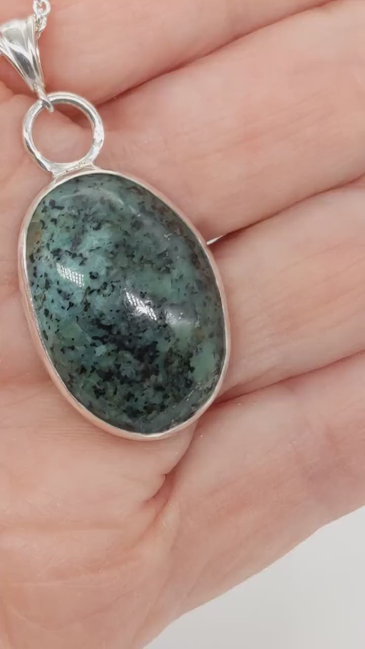 Demo clip of the Fraser River Turquoise Pendant showcasing the bezel features and blue-green and black matrix patterns.