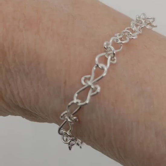 A demo clip of the infinity bow bracelet on a human wrist.