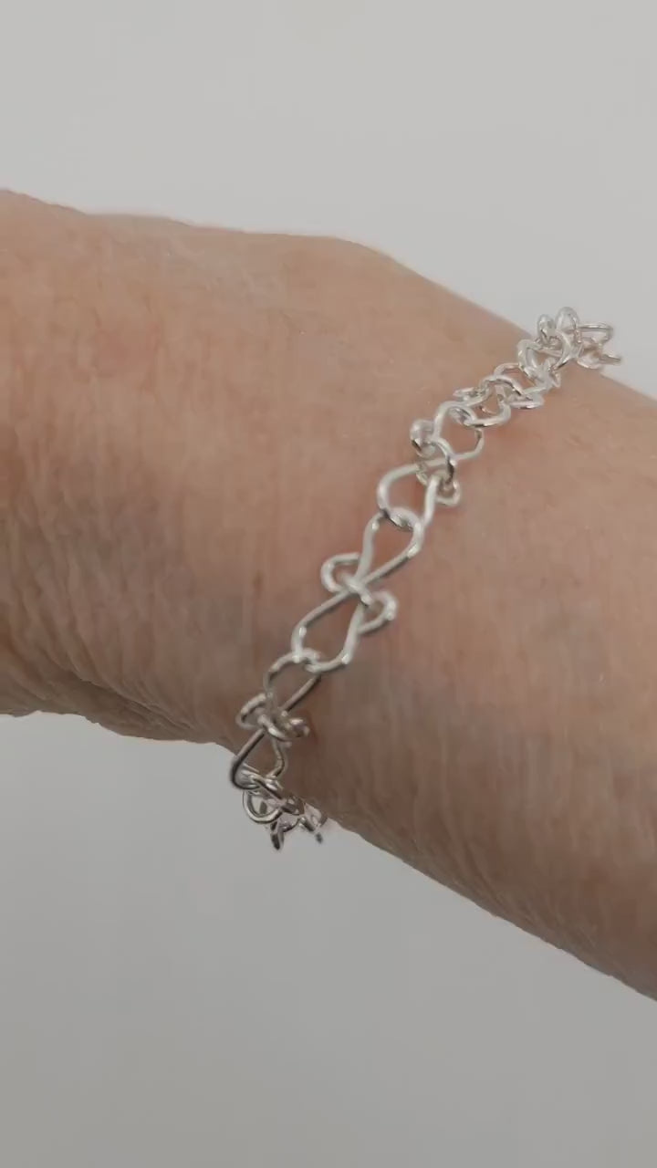 A demo clip of the infinity bow bracelet on a human wrist.
