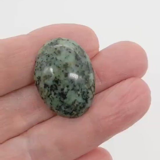 Demo clip of Fraser River Turquoise Cabochon showing the polished side and reverse side.