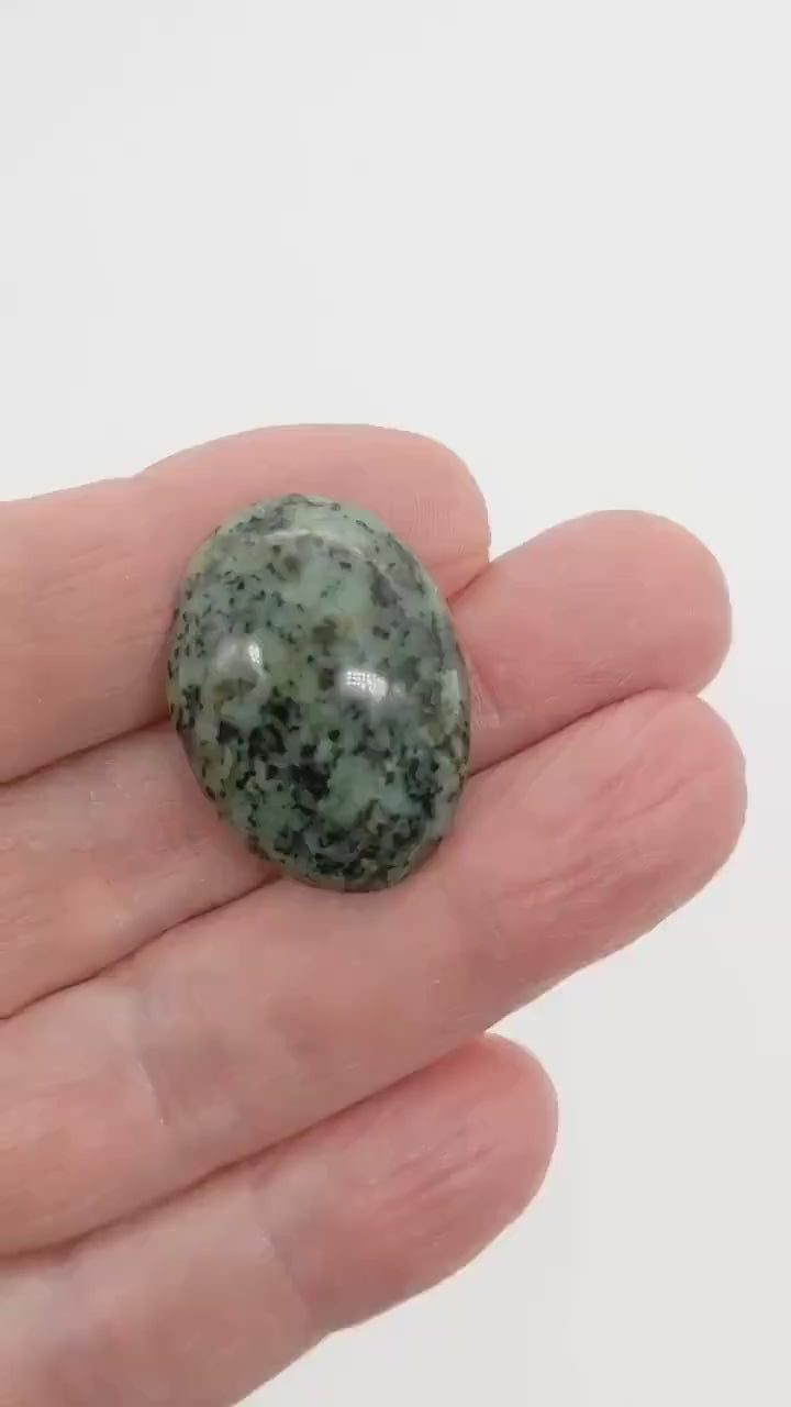 Demo clip of Fraser River Turquoise Cabochon showing the polished side and reverse side.