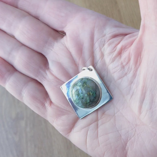 Demo clip in hand of this Natural green Variscite pendant in Argentium 935 silver with Argentium silver chain