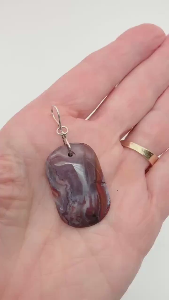 Demo clip showing Red Mexican agate tag shaped pendant with Argentium silver bail.