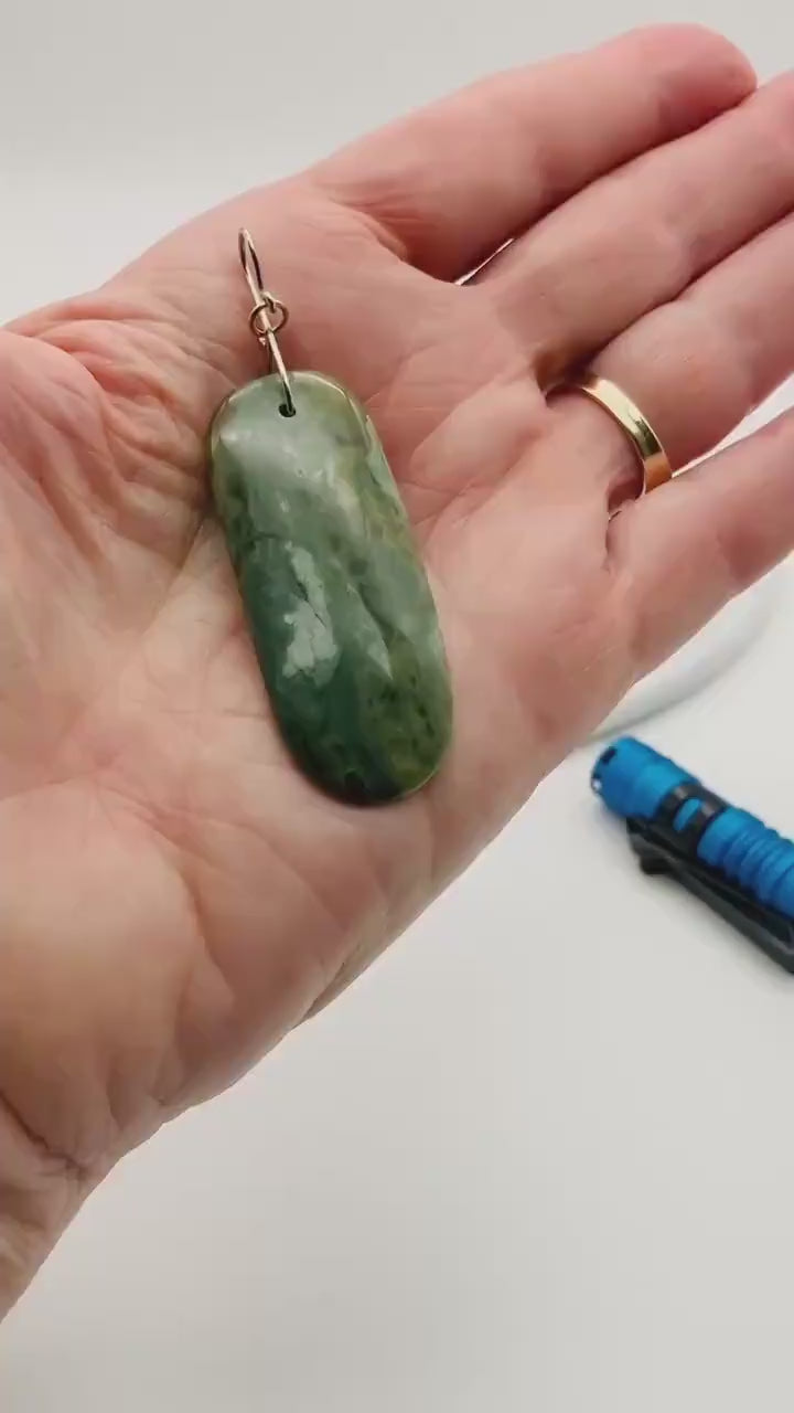 Demo clip of California Nephrite Jade pendant showing the translucent nature of the pendant with a back light.