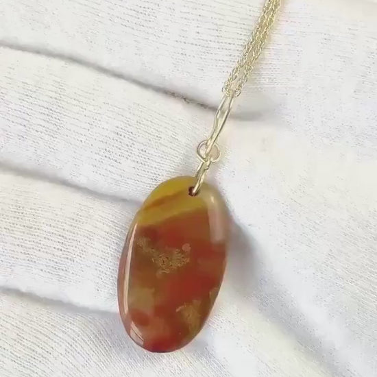 Demo clip of sonoran sunrise pendant with gold-filled handcrafted bail.  Shown on white glove background anchor with a section of chain for demo purposes.
