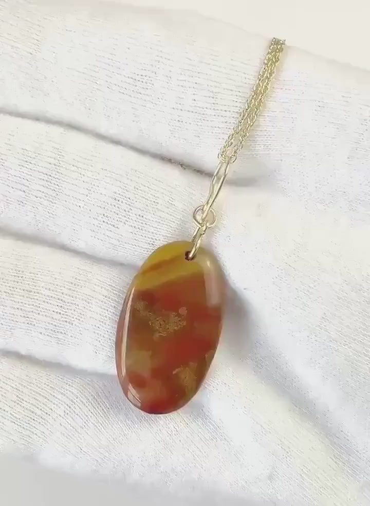 Demo clip of sonoran sunrise pendant with gold-filled handcrafted bail.  Shown on white glove background anchor with a section of chain for demo purposes.