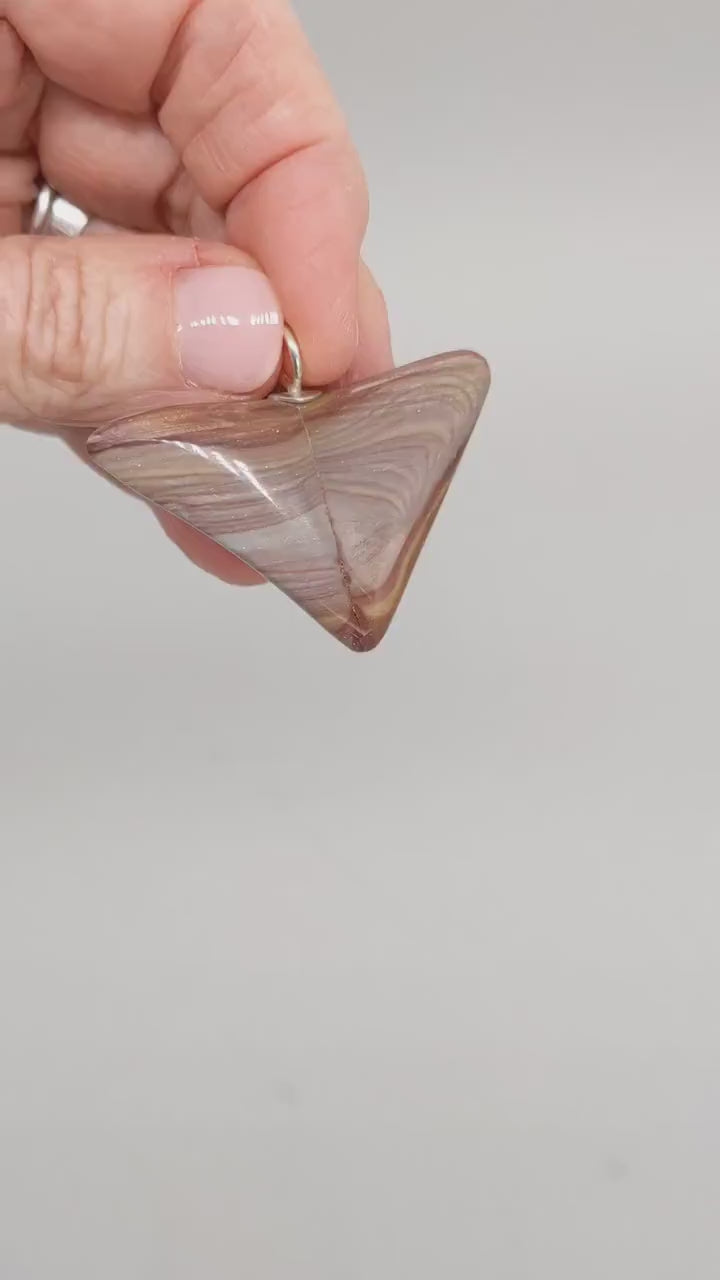  This short video shows the pendant revealing the natural colors and patterns of Petrified Rainbow Wood. 
