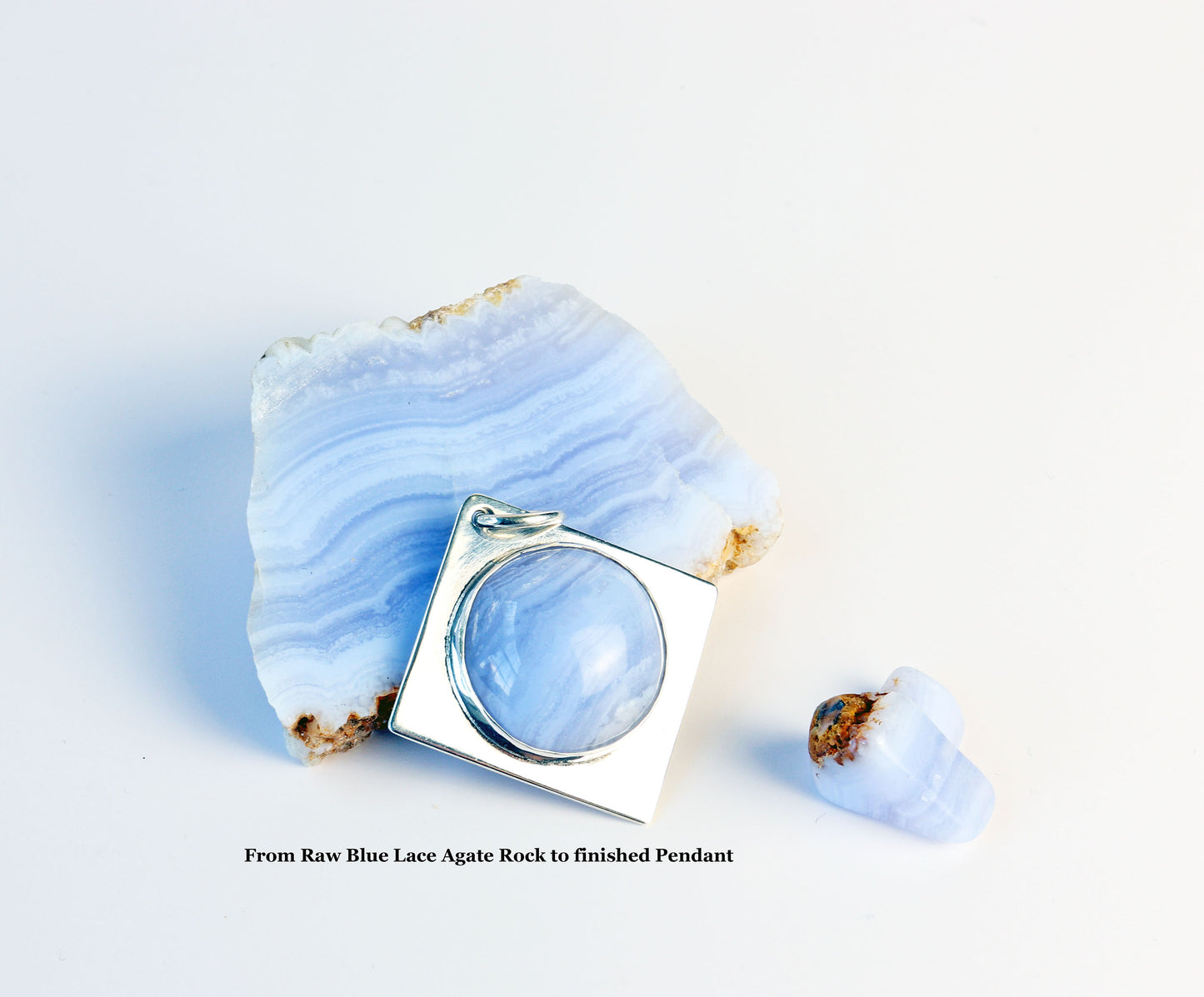 Raw Blue Lace Agate rock used to craft the pendant shown on light gray background.