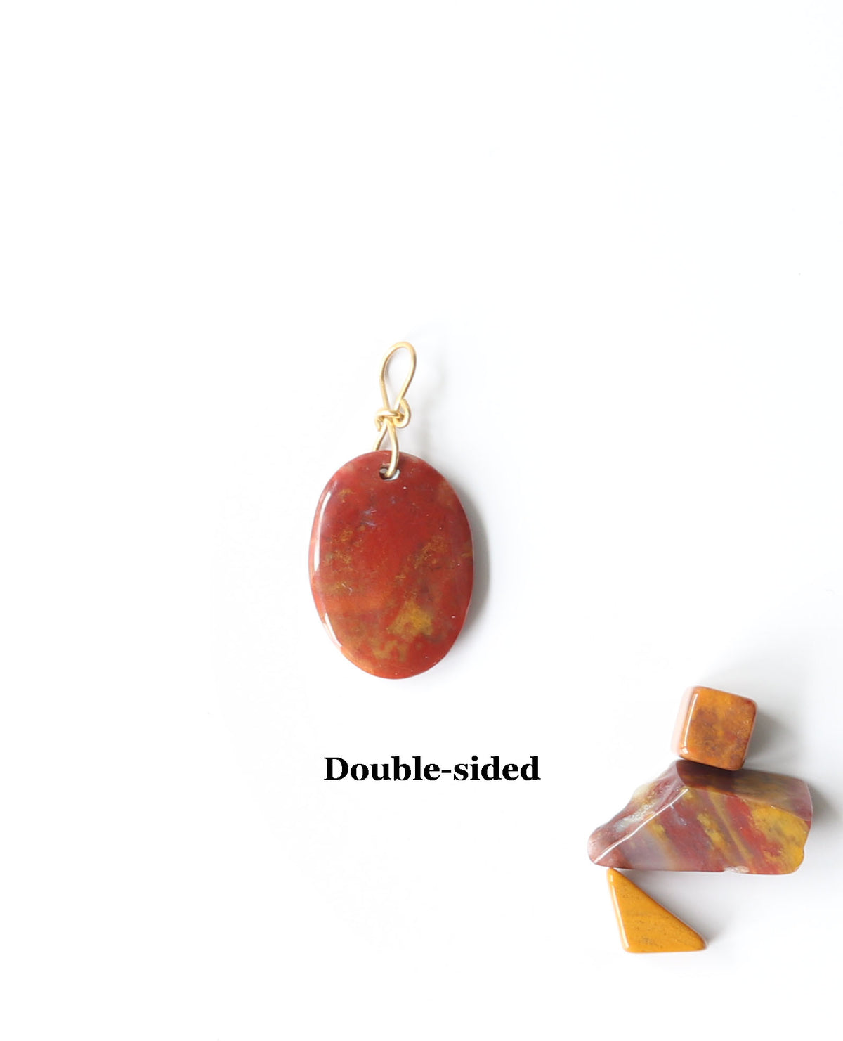 One-of-a-kind Sonoran Sunrise pendant, polished on both sides and finished with a handcrafted 14/20 gold-filled infinity bow-style bail.The jewelry is set against a white background and shows the reverse side of this pendant.