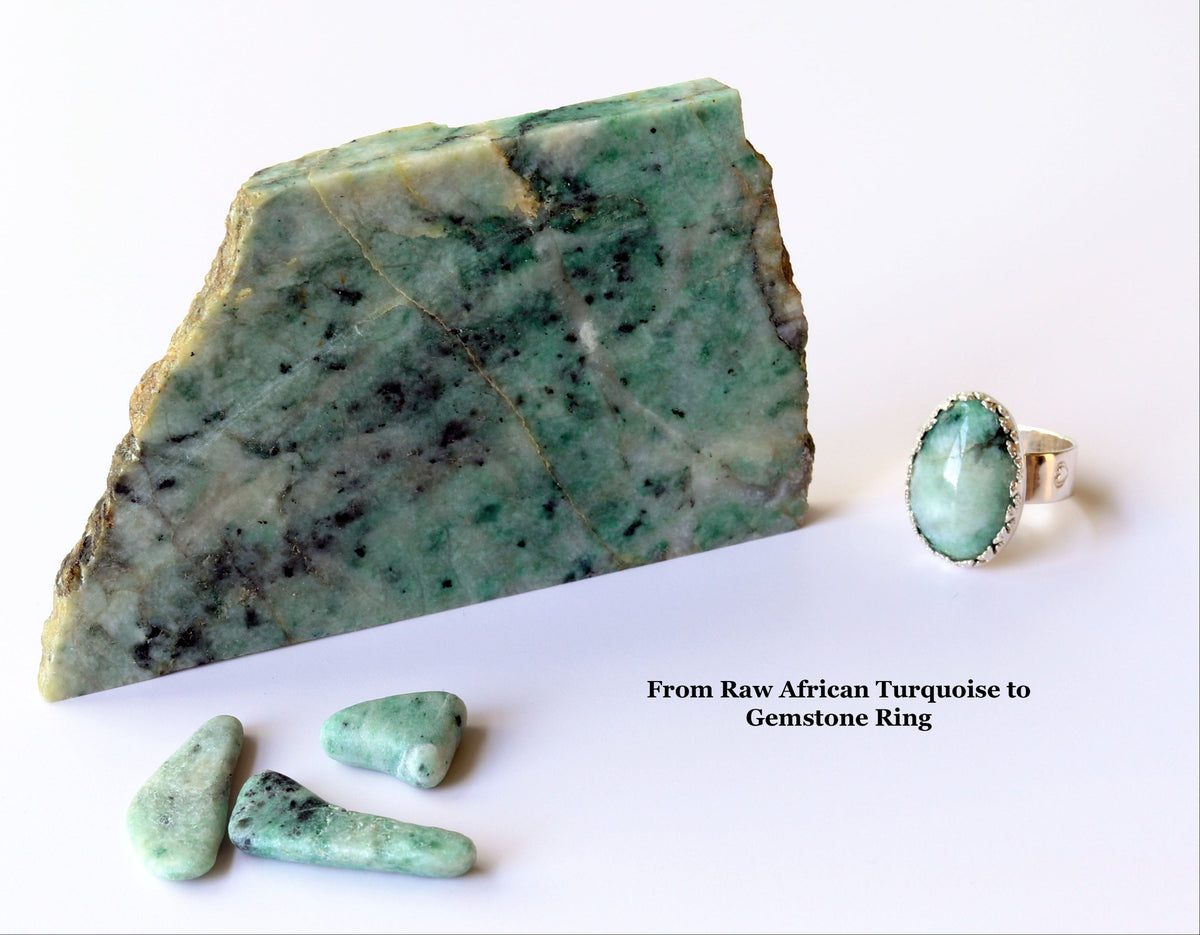 A raw African Turquoise Jasper stone slab and three polished turquoise jasper stone pieces displayed on a white background, alongside a African Turquoise Jasper ring handcrafted in polished Argentium 935 silver. Text reads 'From Raw African Turquoise to Gemstone Ring'.