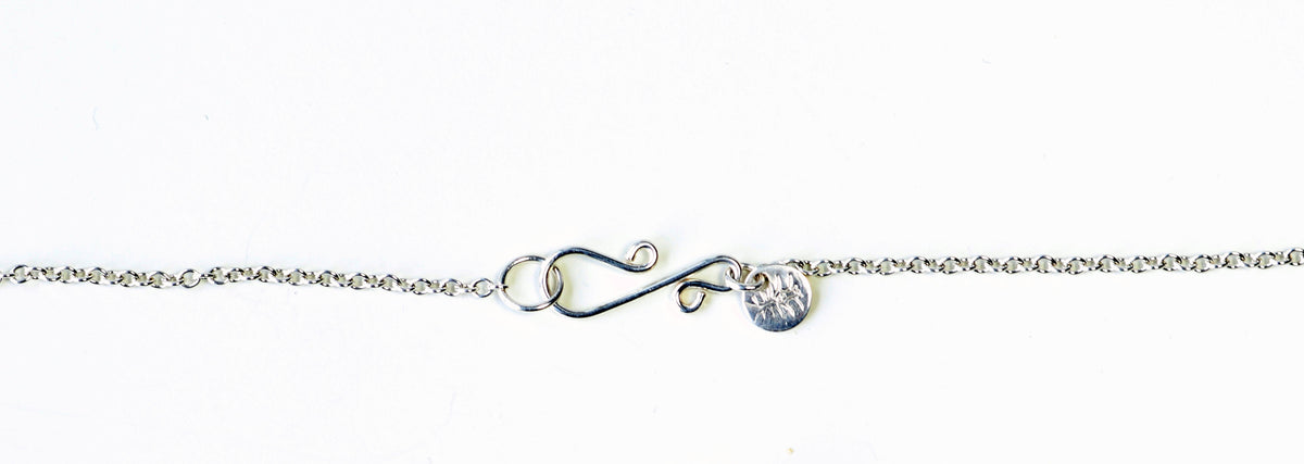 Closeup of custom s-hook clasp featured on the 1.9 oval Argentium necklace included with the Red Mexican agate pendant.