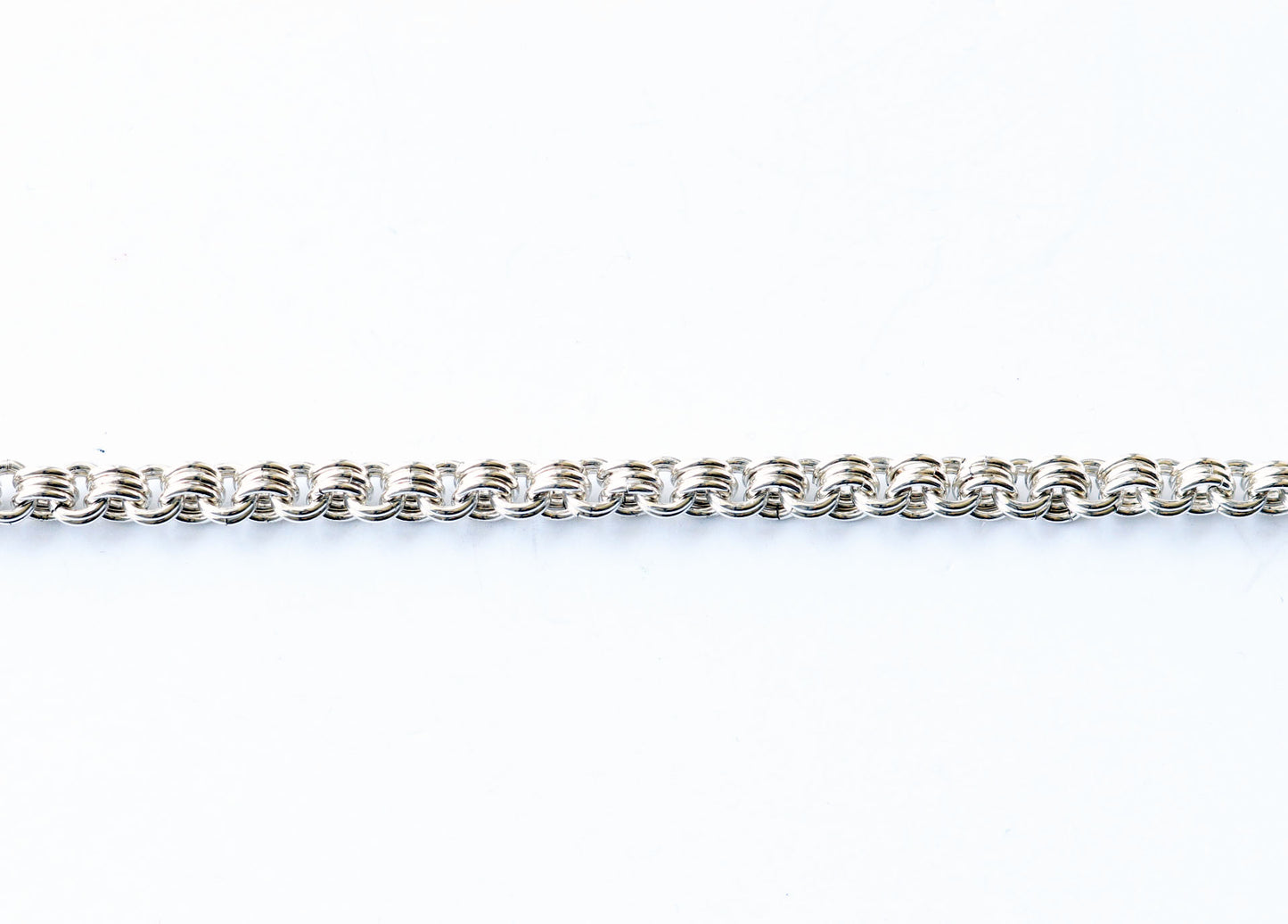 Argentium 940 handmade chain section shown of triple to double weave.