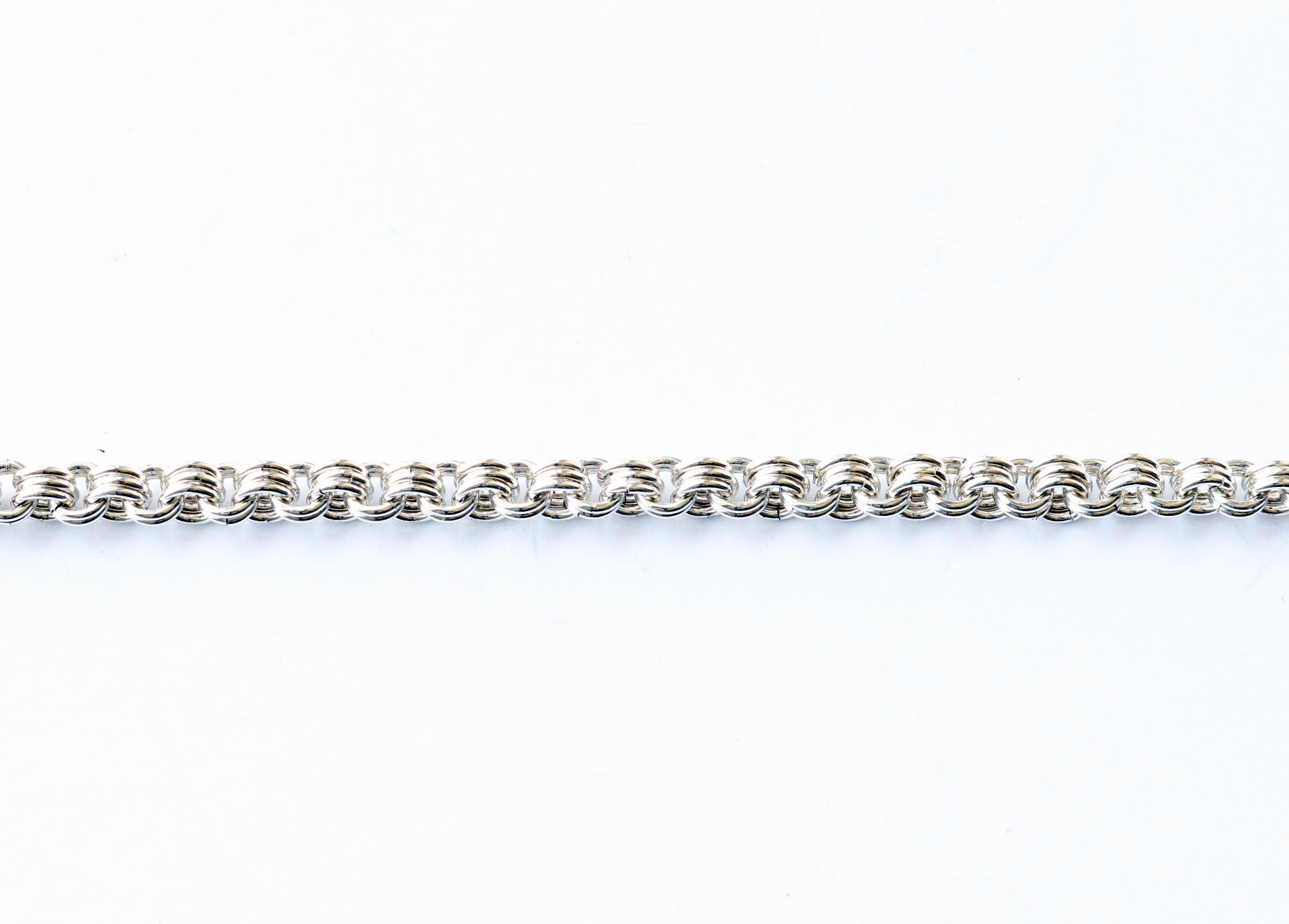 Argentium 940 handmade chain section shown of triple to double weave.