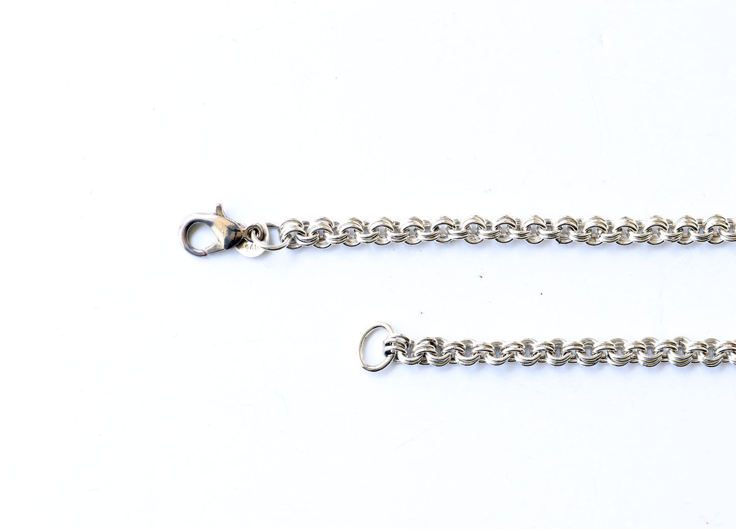 Argentium 940 teardrop clasp closeup shown on white background.