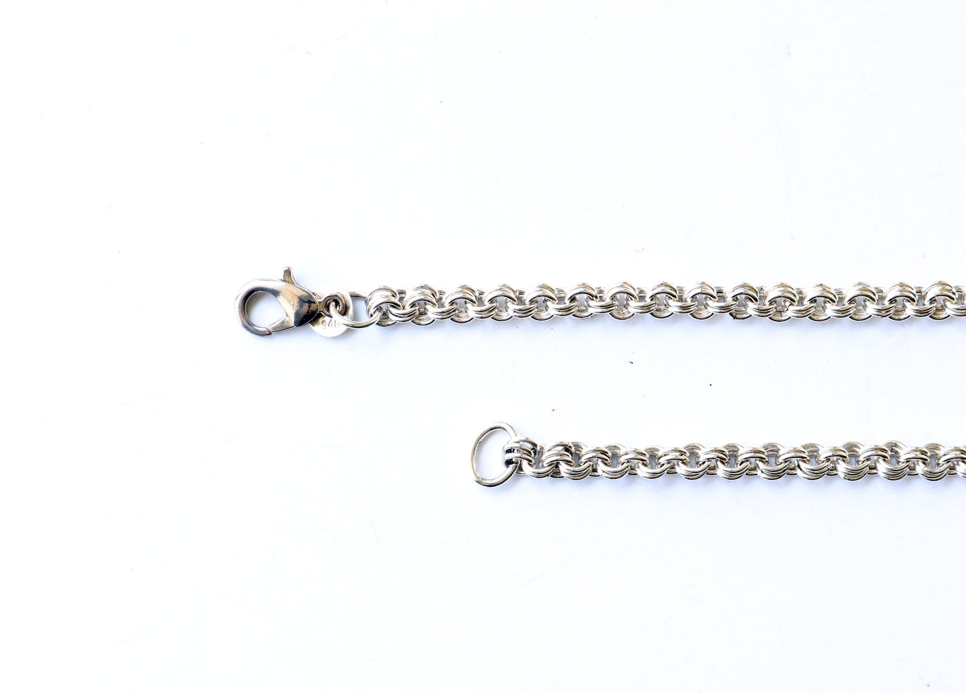 Argentium 940 teardrop clasp closeup shown on white background.